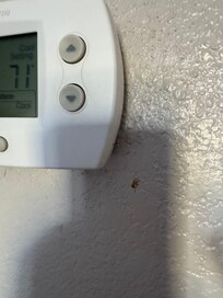 Stains on the wall by thermostat