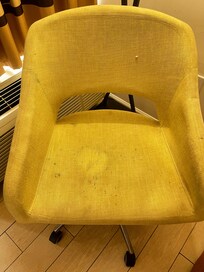 Moldy dirty chair with blood stains.