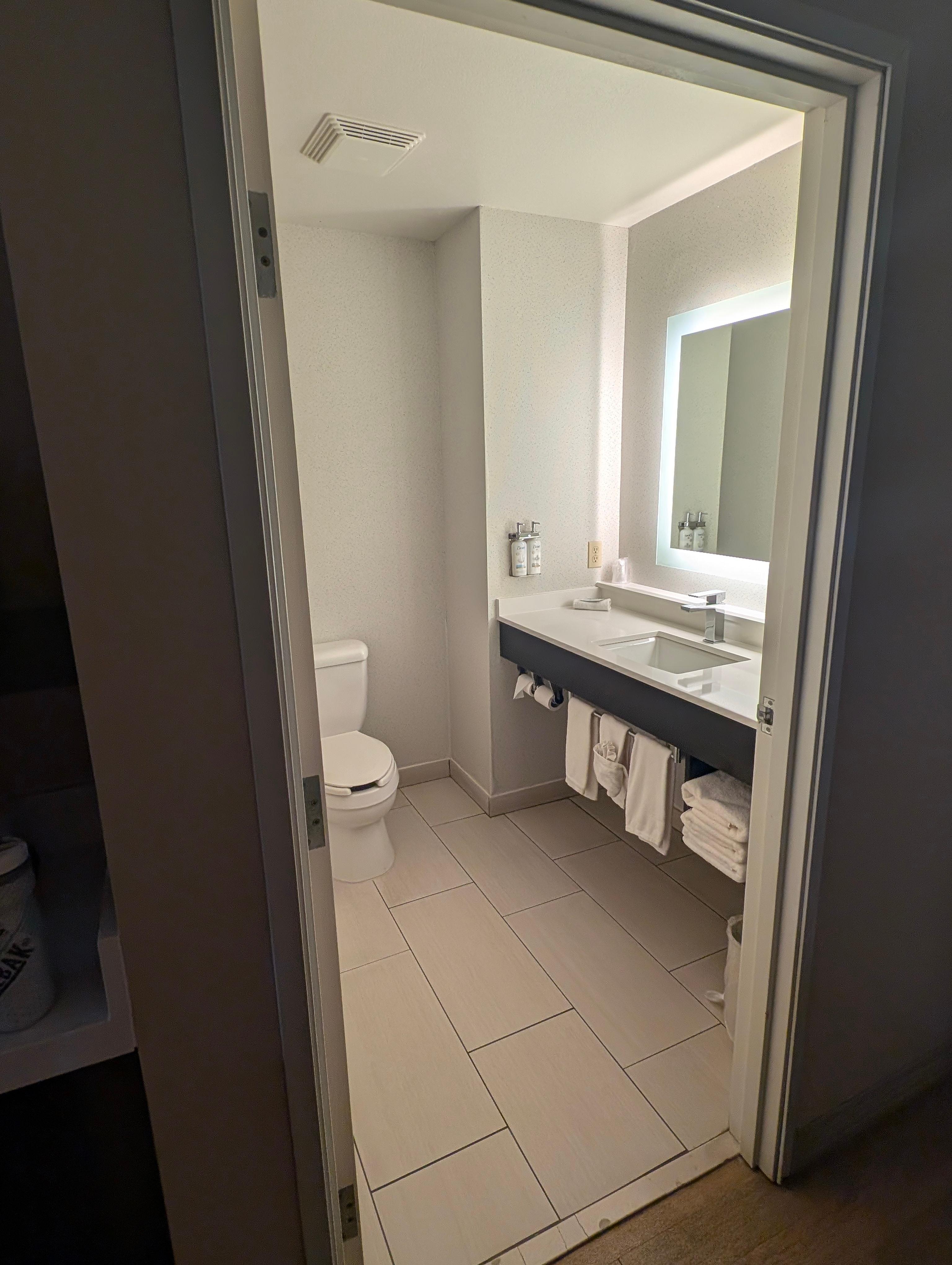 Nice size bathroom with plenty of counter space, shower, tub & plenty of towels.