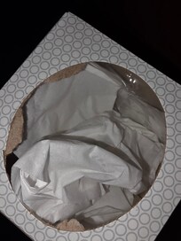 Dirty tissue stuffed back in box