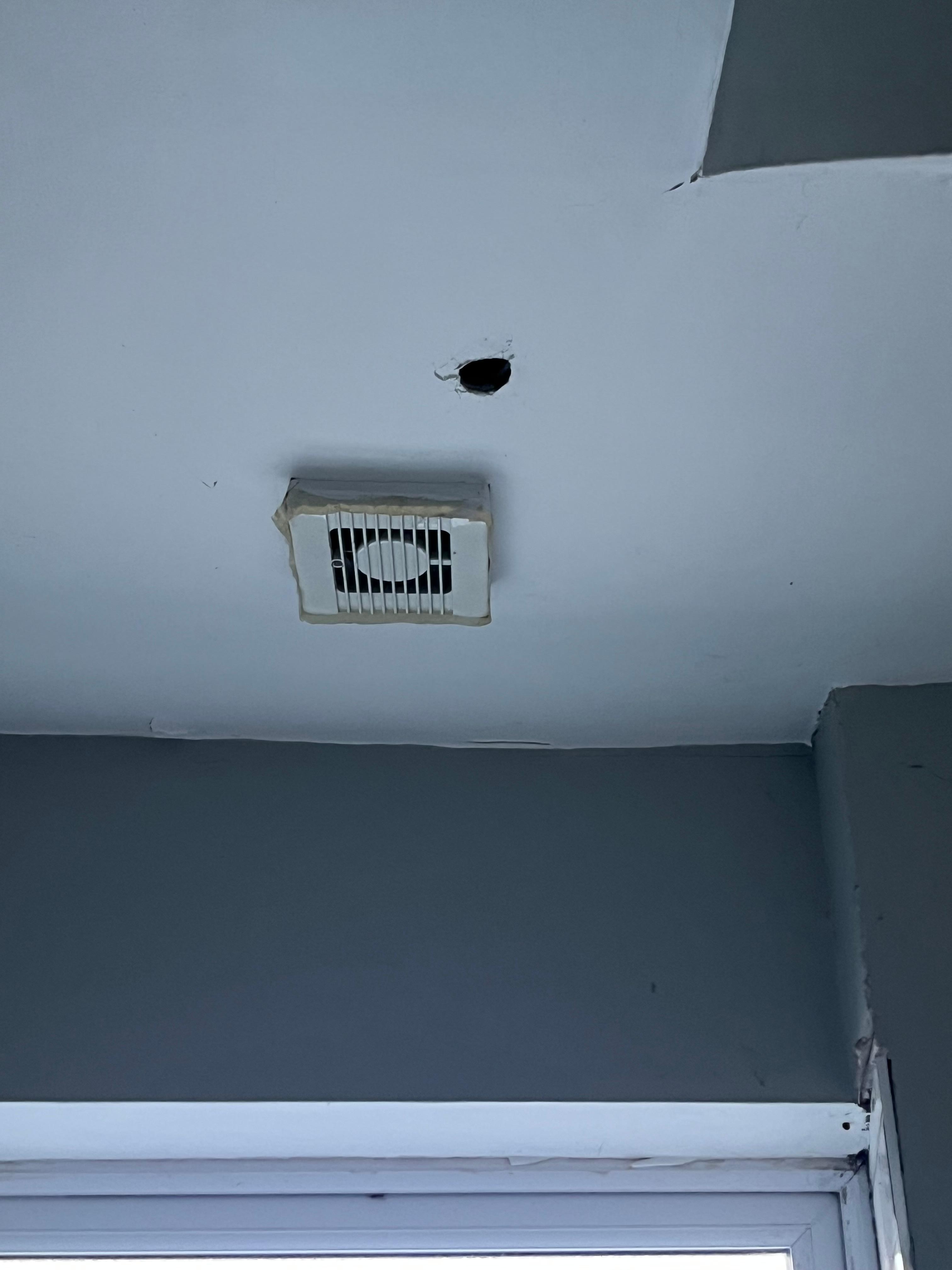 Hole in bathroom ceiling
