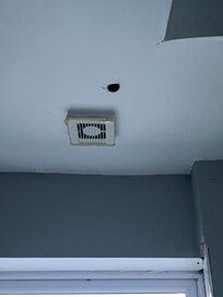 Hole in bathroom ceiling