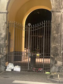 Entrance to hotel with garbage.