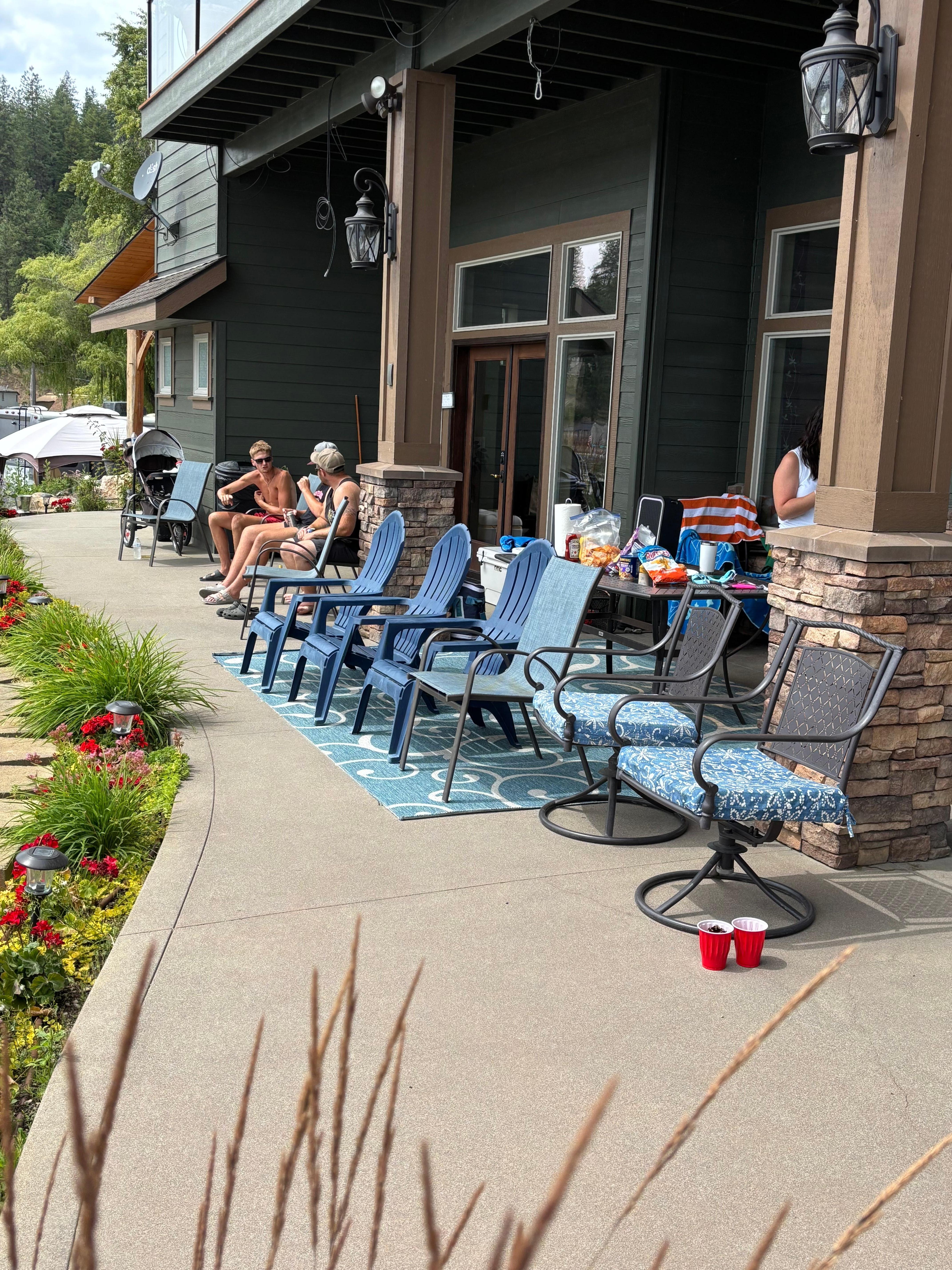 Patio area overlooking the lake with dining table and barbecue area