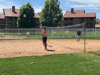 Playing sand volleyball at the clubhouse