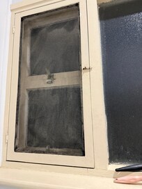 Bathroom window. Dusty/dirty screen. Woodwork could do with fresh paint