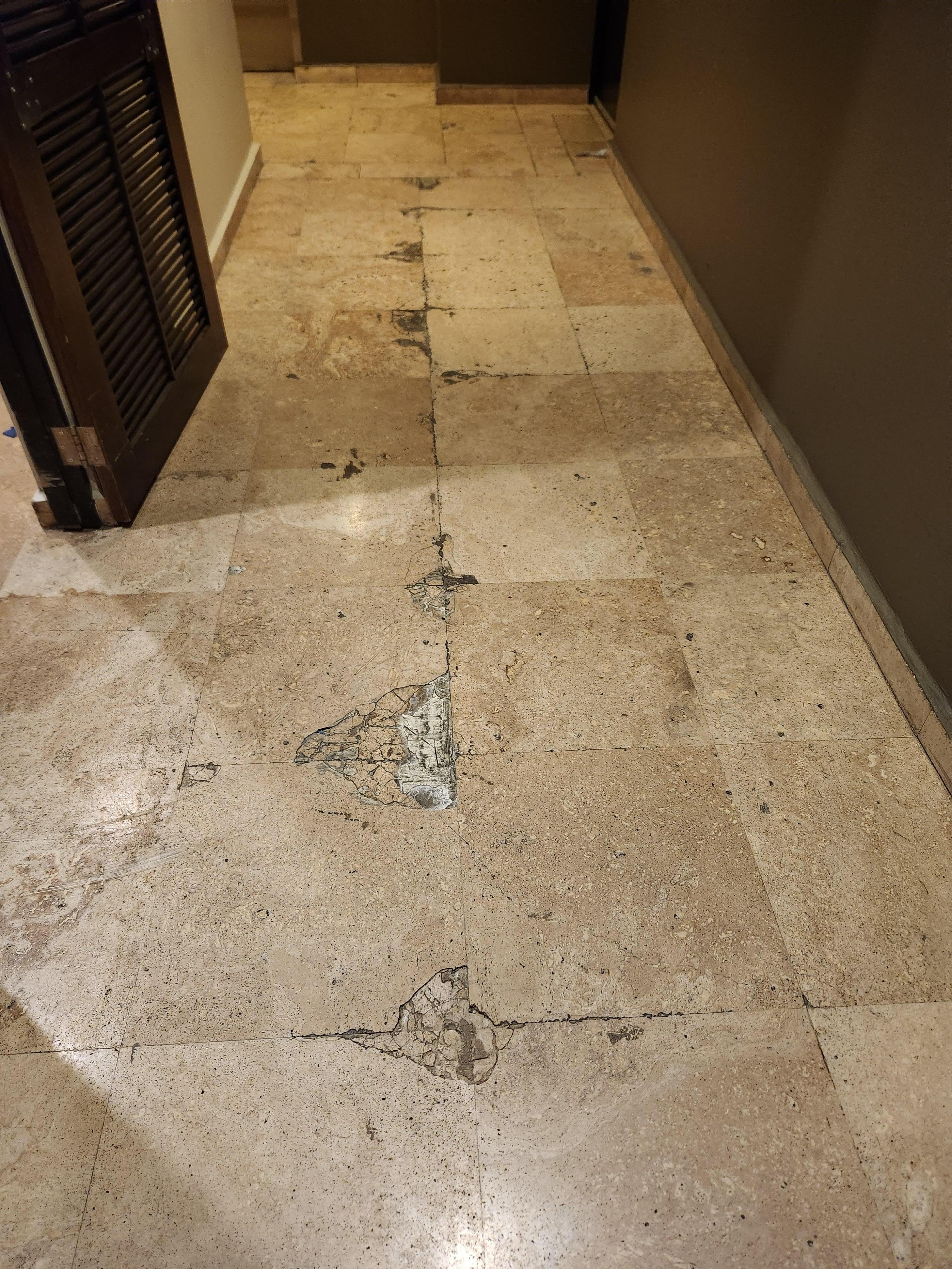 Broken tiles in the hallway.