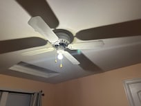 Ceiling fan had dust and dirt hanging from it