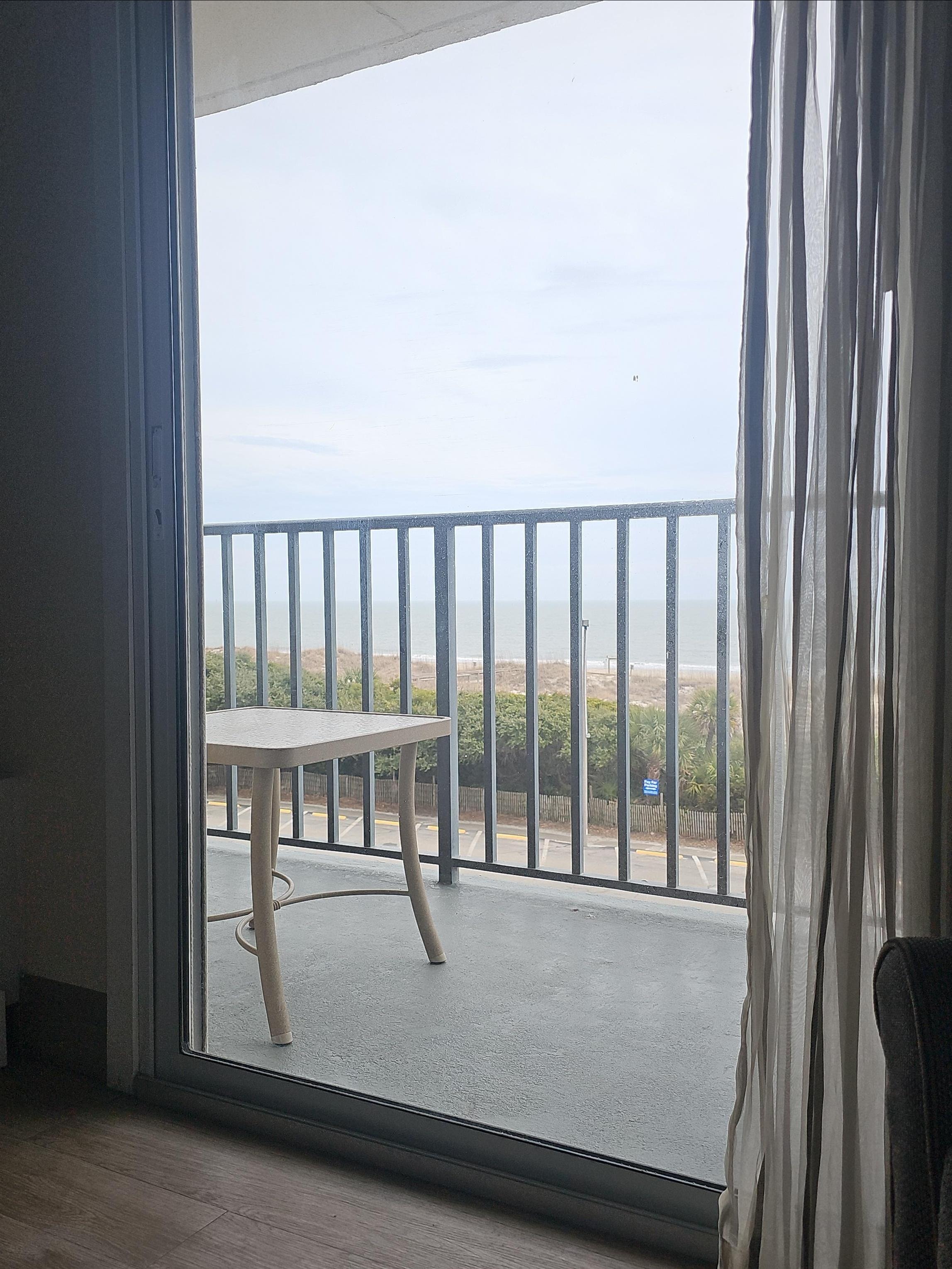View of the balcony and beach.