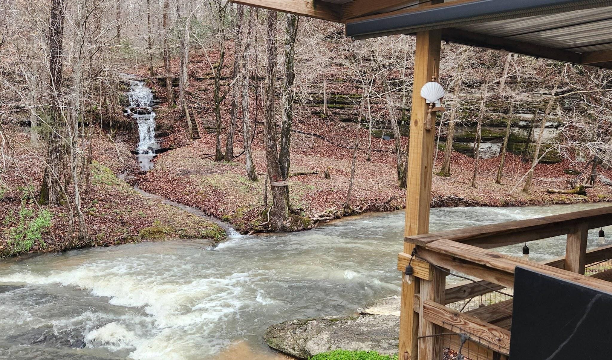 The creek looks more like a small river after it rains.