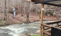 The creek looks more like a small river after it rains.