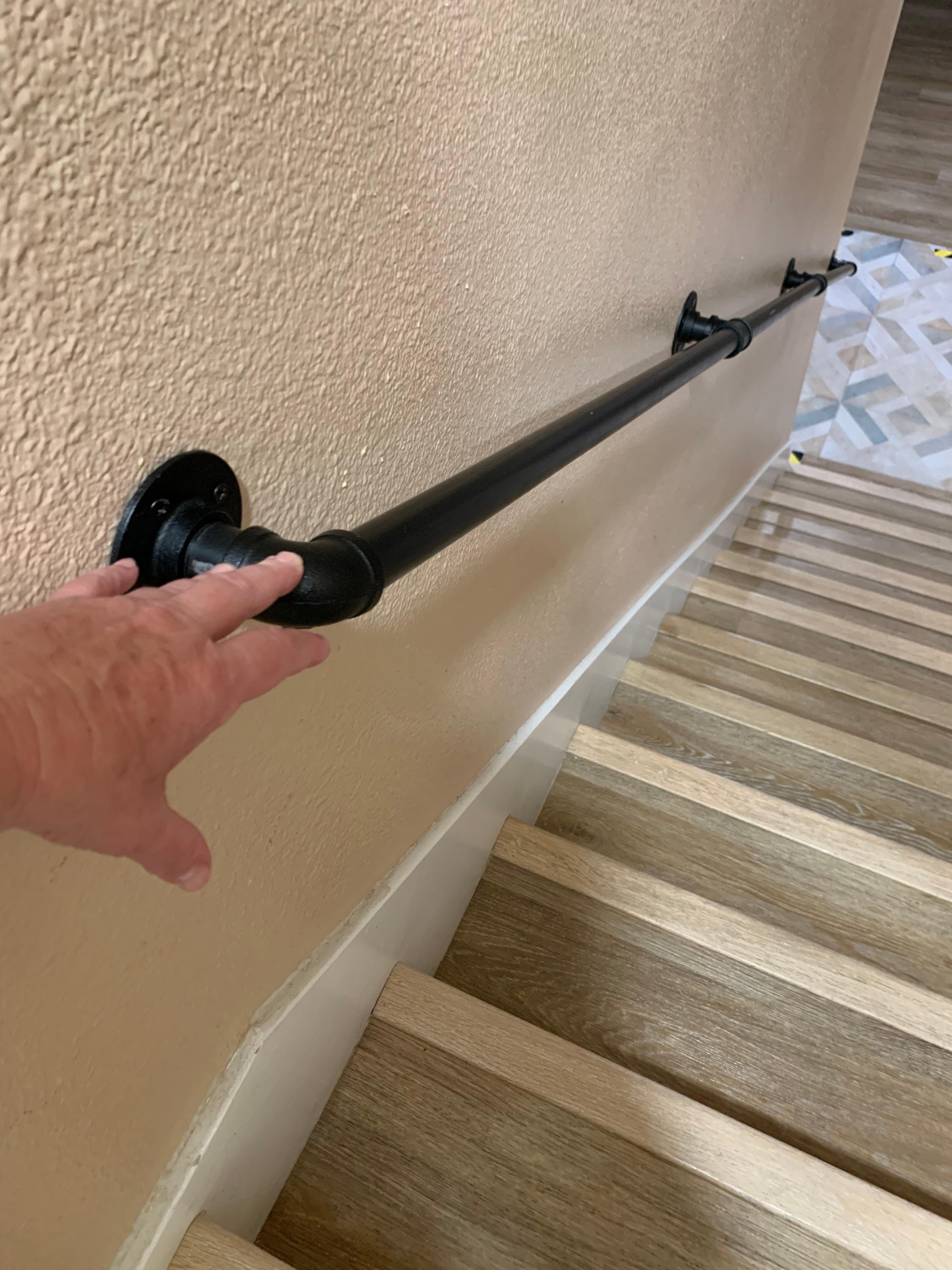 You had to bend over to grab the handrail at the top landing. 