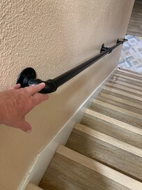 You had to bend over to grab the handrail at the top landing.