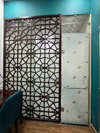 Bathroom is carved out from the bedroom and just separated by a acrylic door