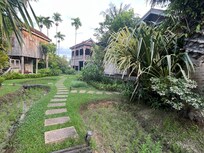 A few of the traditional wooden homes that now are Sala Lodges!