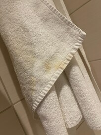Dirty and stained towel provided in the room. Not clean, not hygienic, and very low quality. Absolutely unacceptable for a hotel claiming to be five-star.