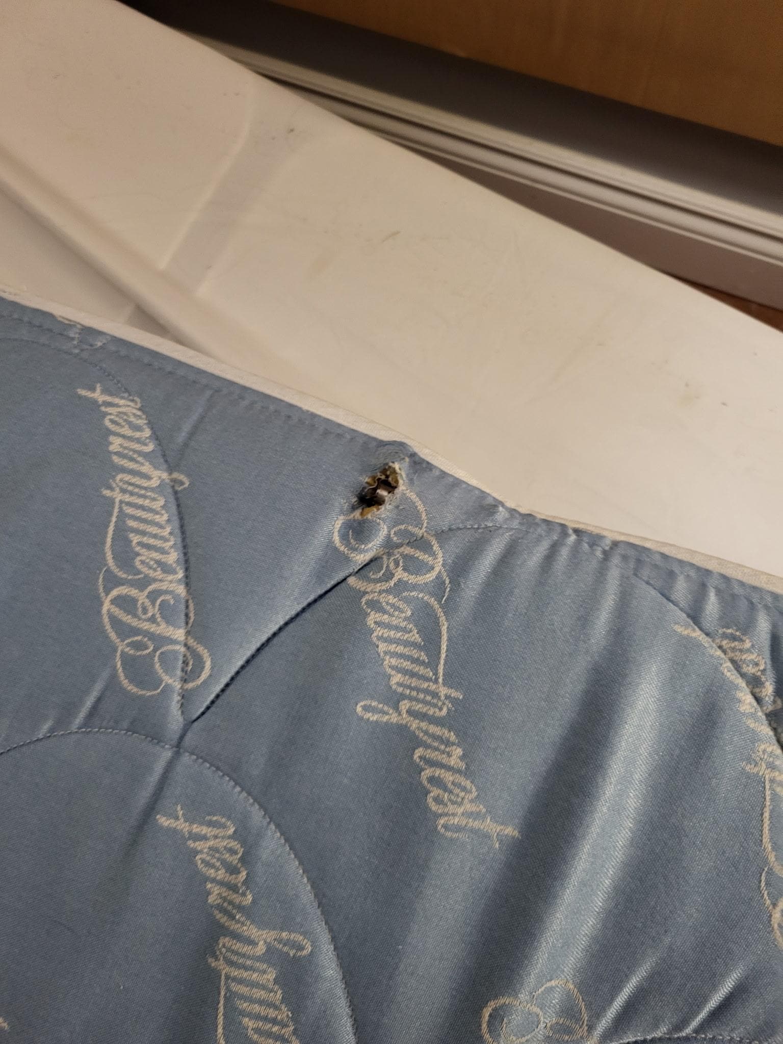 Mattress spring popping out needing to be shoved back in
