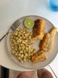 Breaded and pan fried mahi-mahi with pan fried potatoes