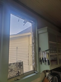 1.5" gap i. Window frame falling out of kitchen...bug vacation