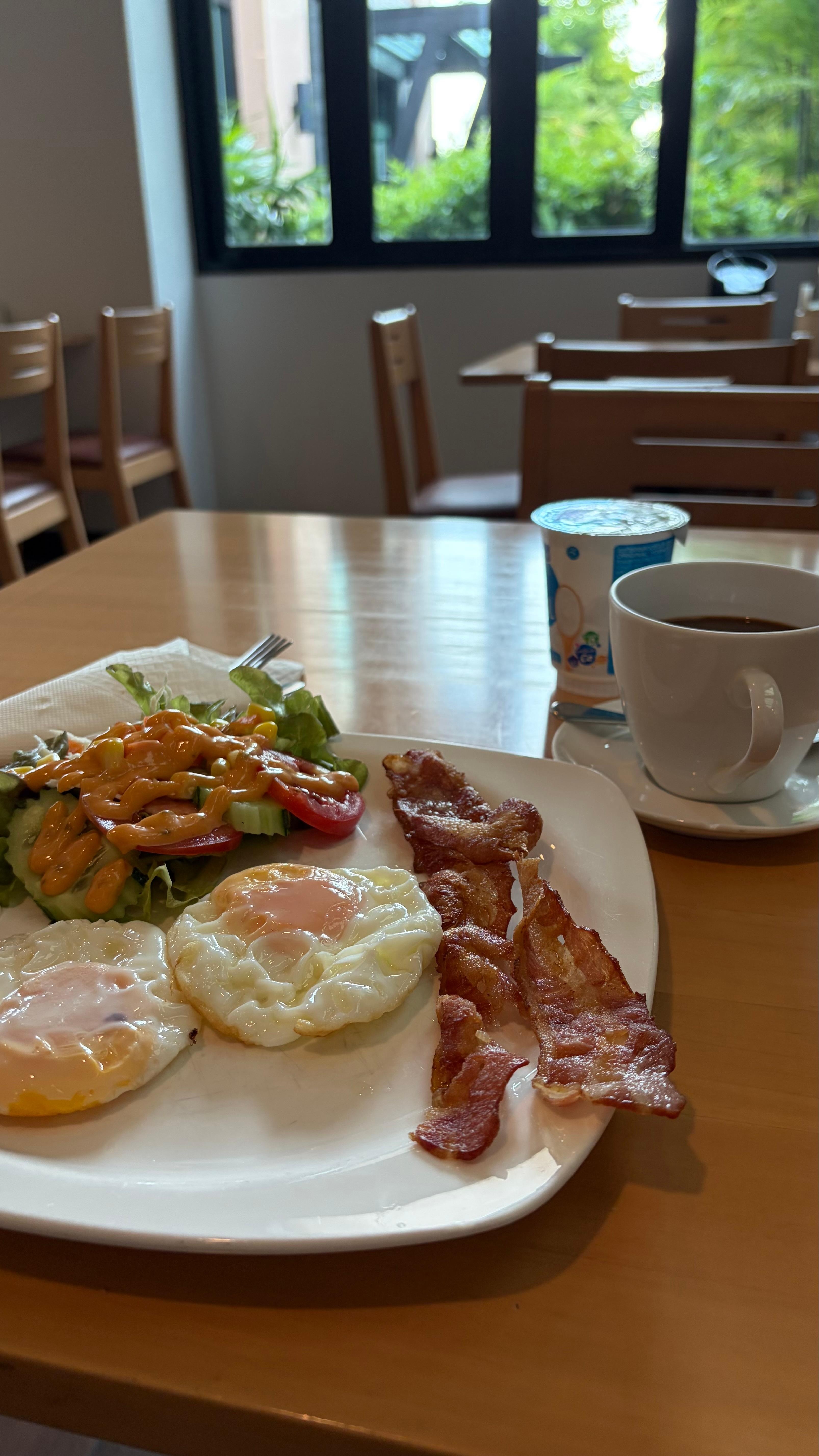 Breakfast view. They have a variety of options, including muesli and yogurt, as well as a non-spicy rice and grounded pork soup. Or try their chicken egg fried rice, which comes with a soup.