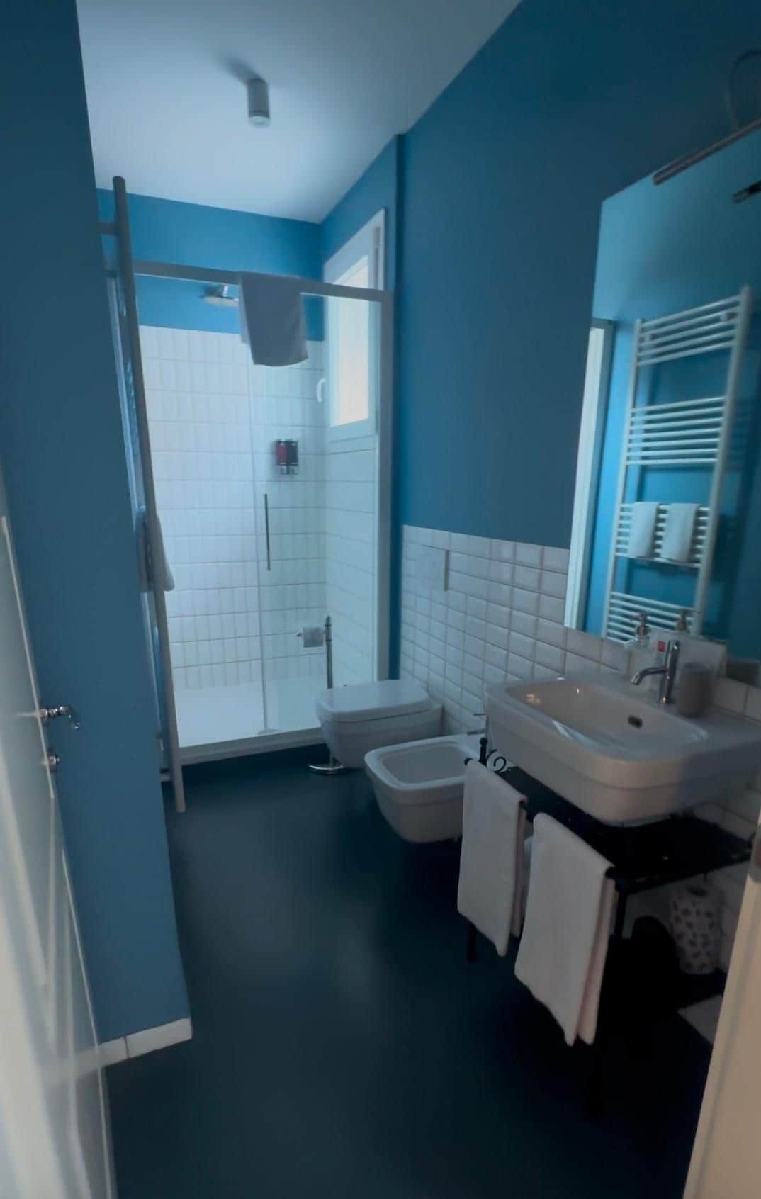 Very clean bathroom. Includes towel warmer & hair dryer