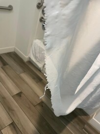 Shower curtain is shredded