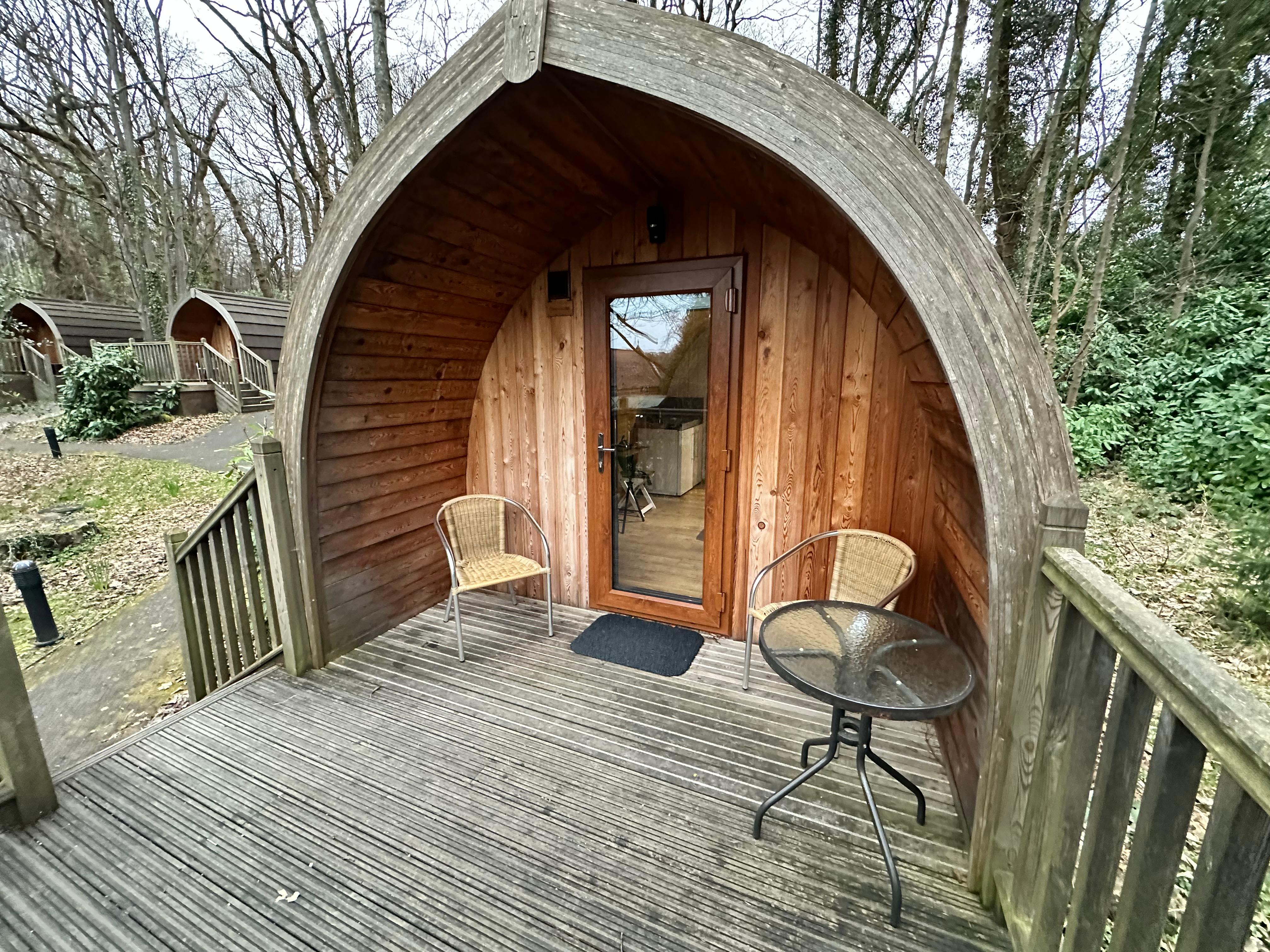 The small front porch on these pods is handy in the Scottish rain!