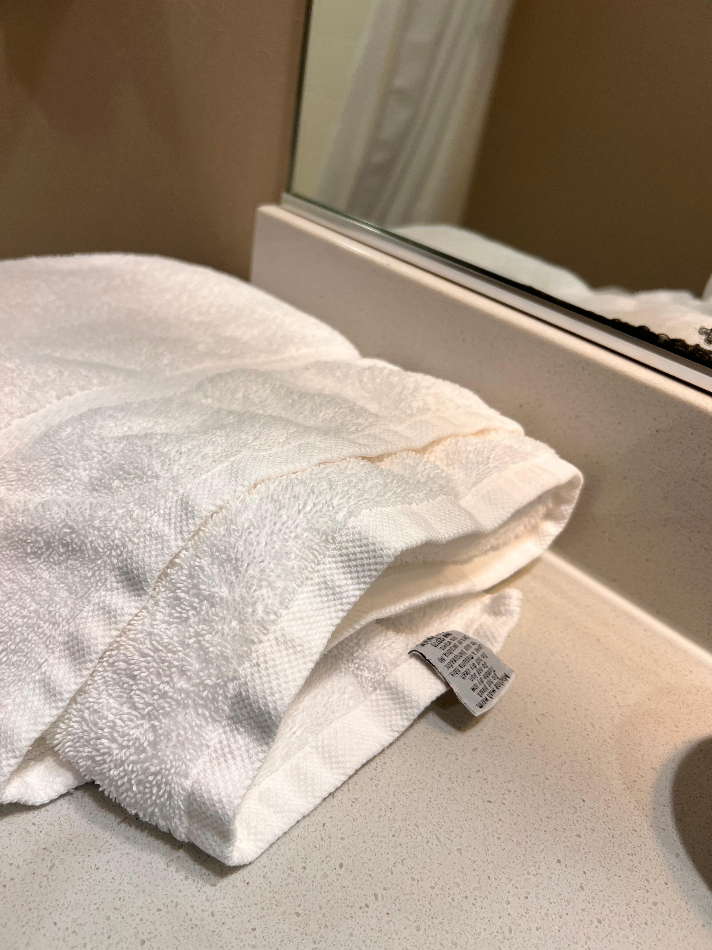 Towels on counter haphazardly, doubt they were clean towels