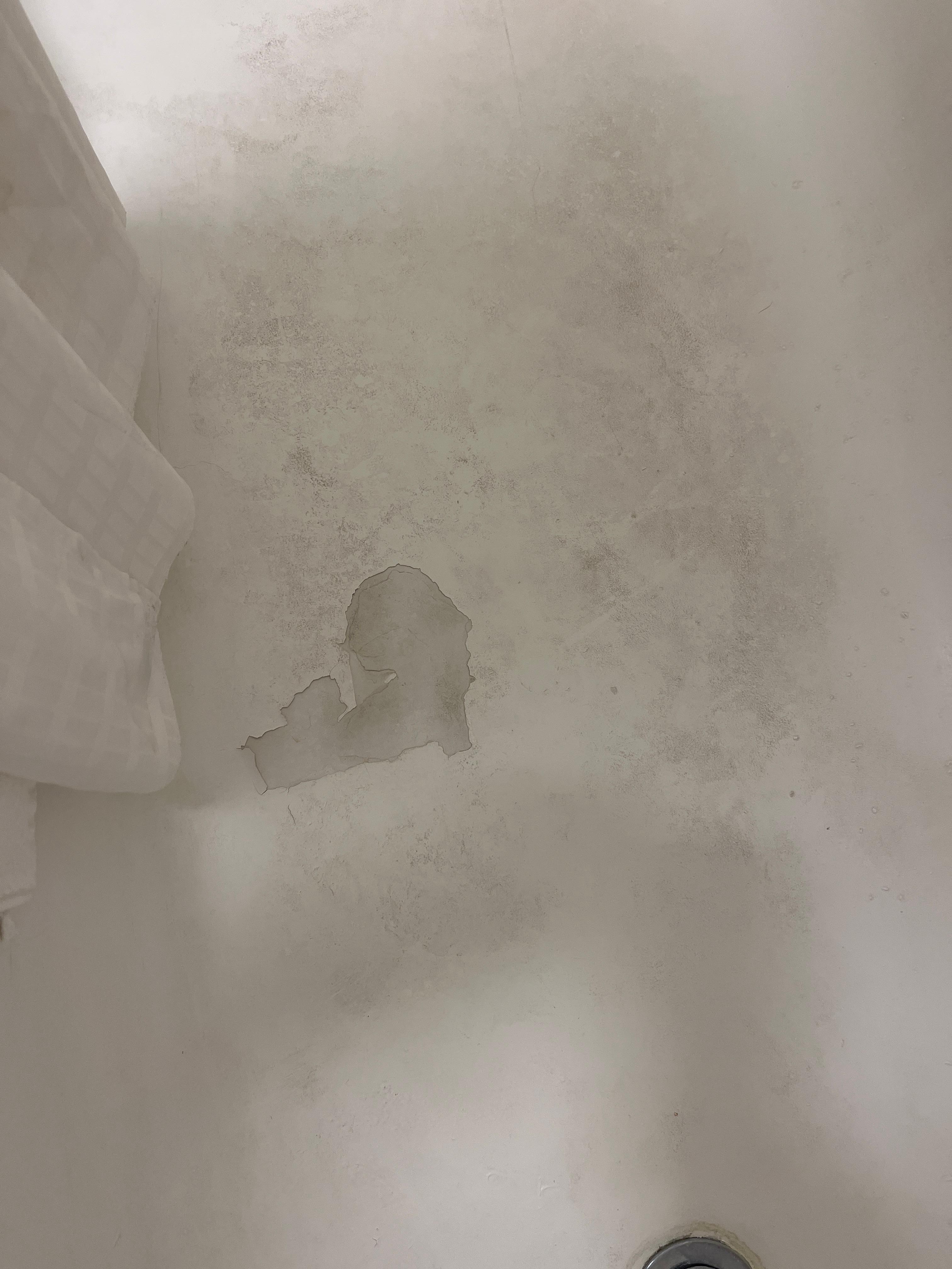 Soap scum in the bathtub. Need to use some elbow grease on that.