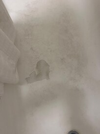 Soap scum in the bathtub. Need to use some elbow grease on that.