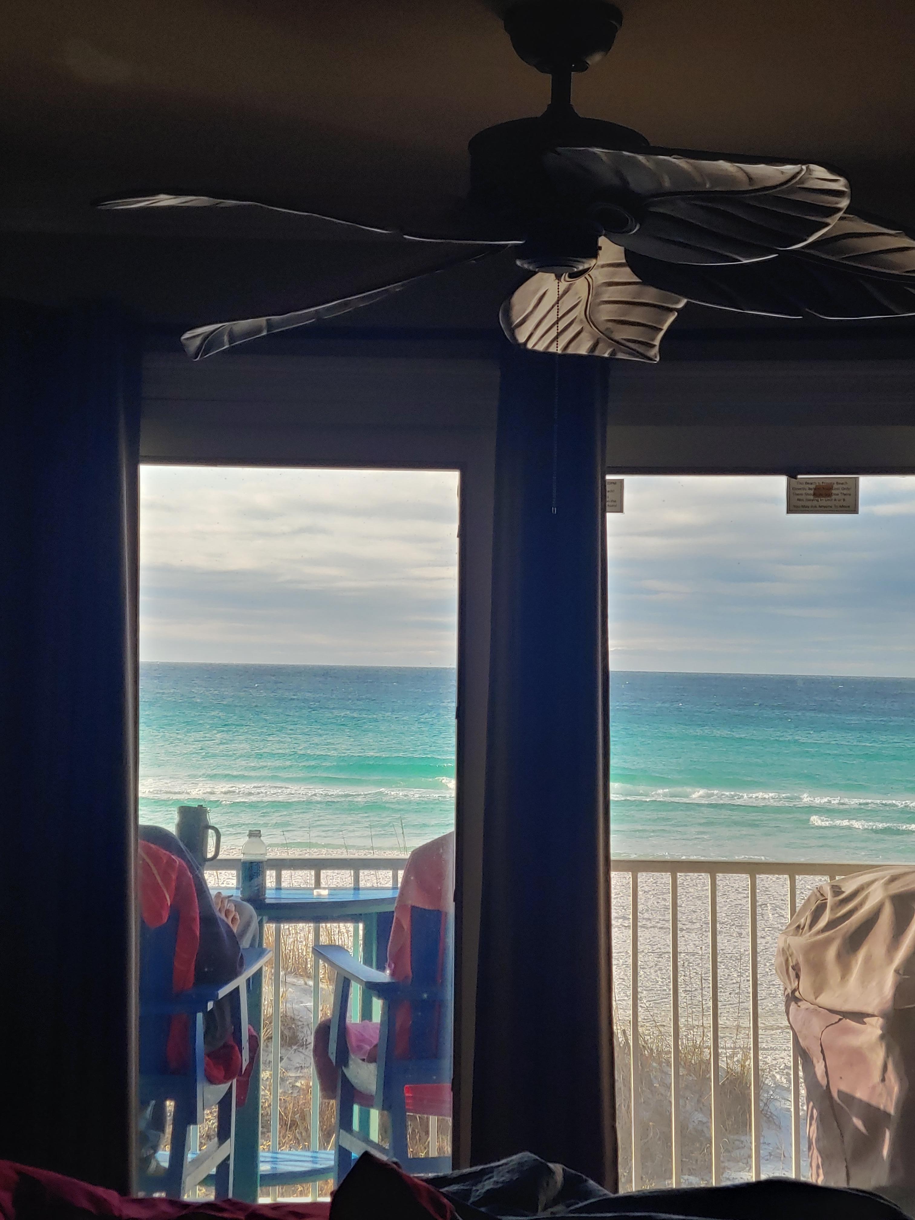 View across bed through balcony doors