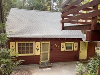 Cabin tucked away under parking deck.