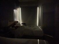 That is nighttime with exterior lights coming in through large gaps because shades don't fit the window.