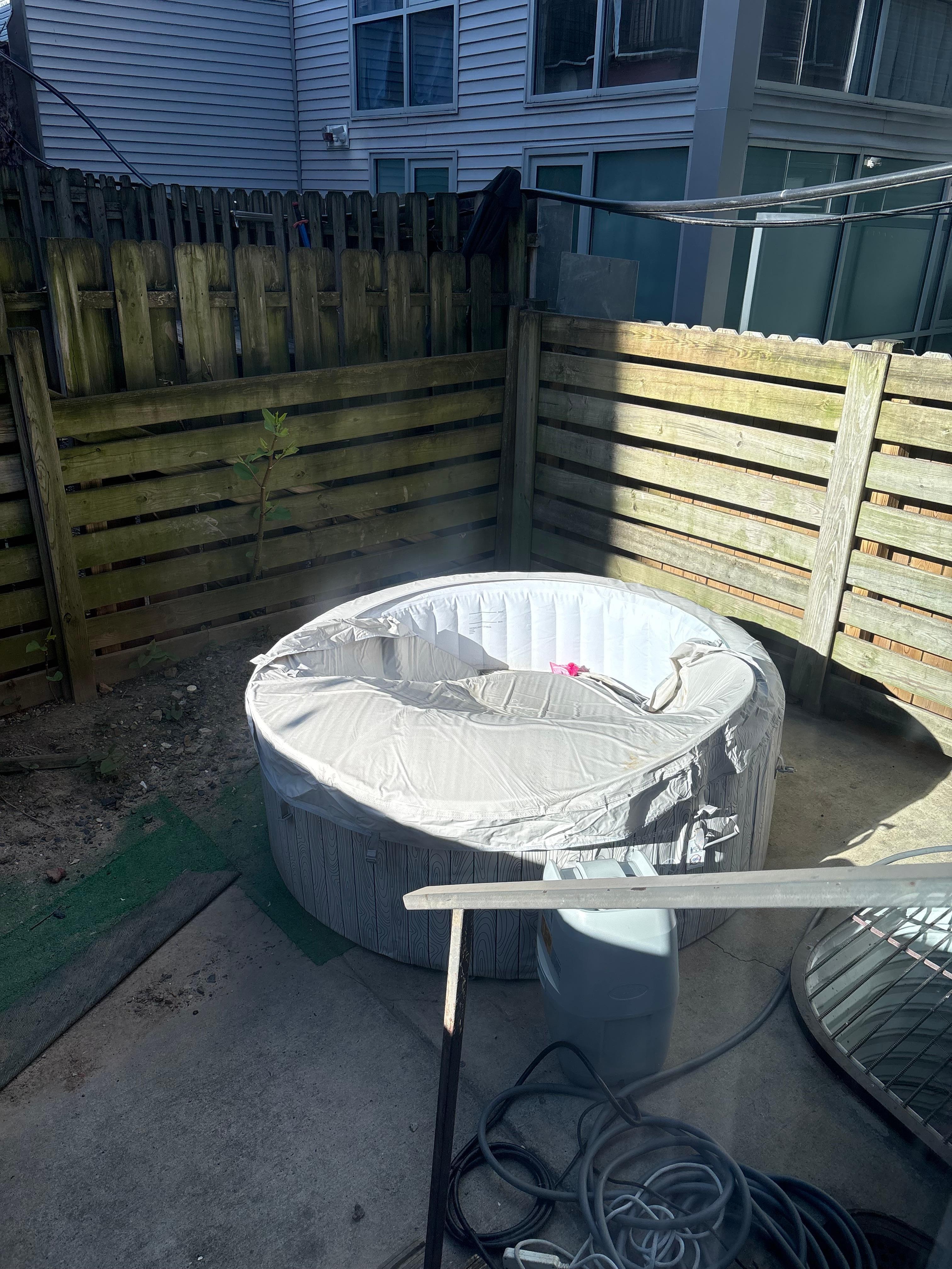 Deflated, empty hot tub