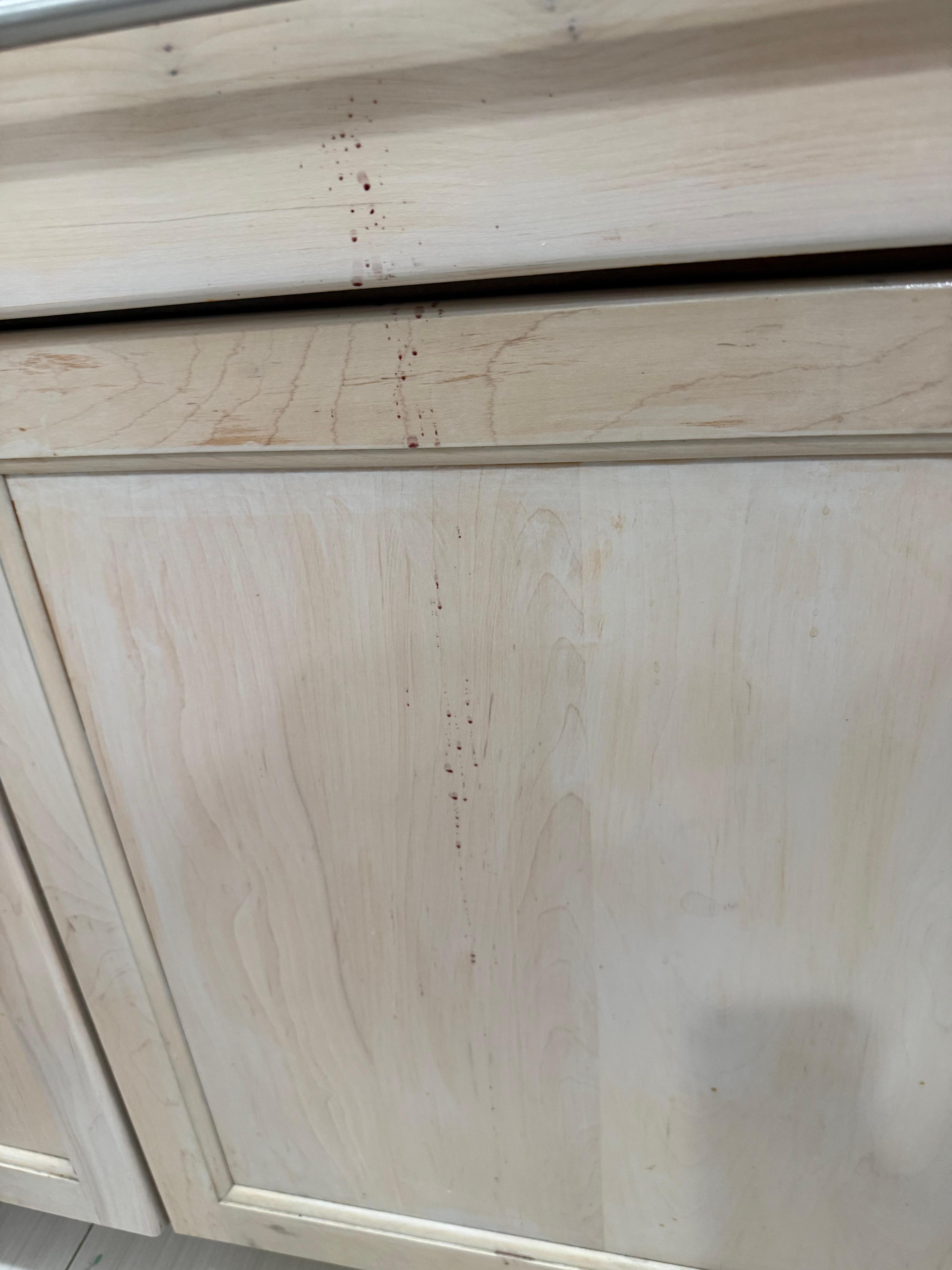 Front of cabinets sticky brown stains