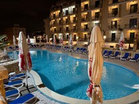 Pool, with hotel in background