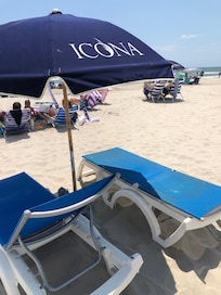 Beach with chairs and umbrella service.