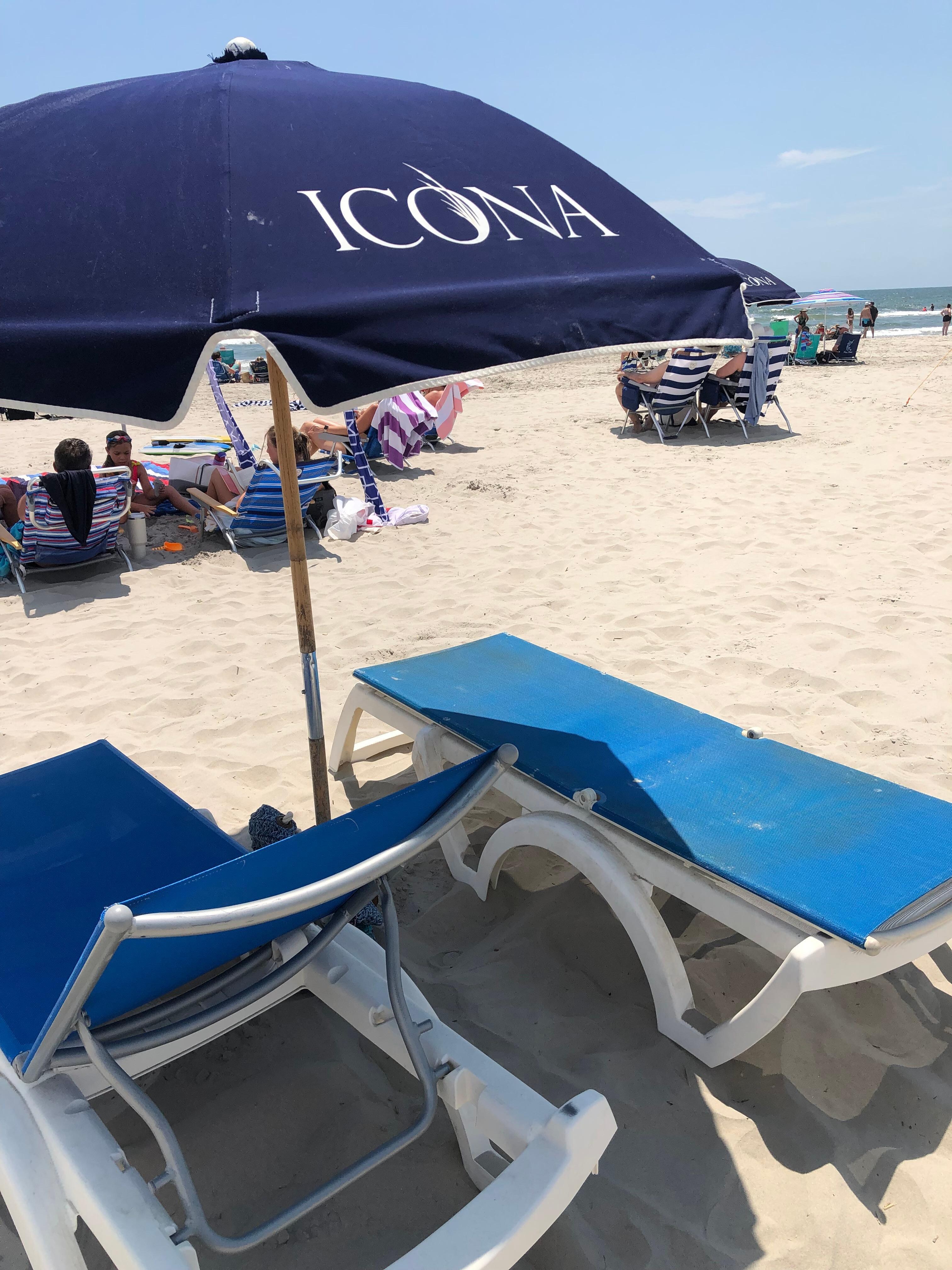 Beach with chairs and umbrella service.  
