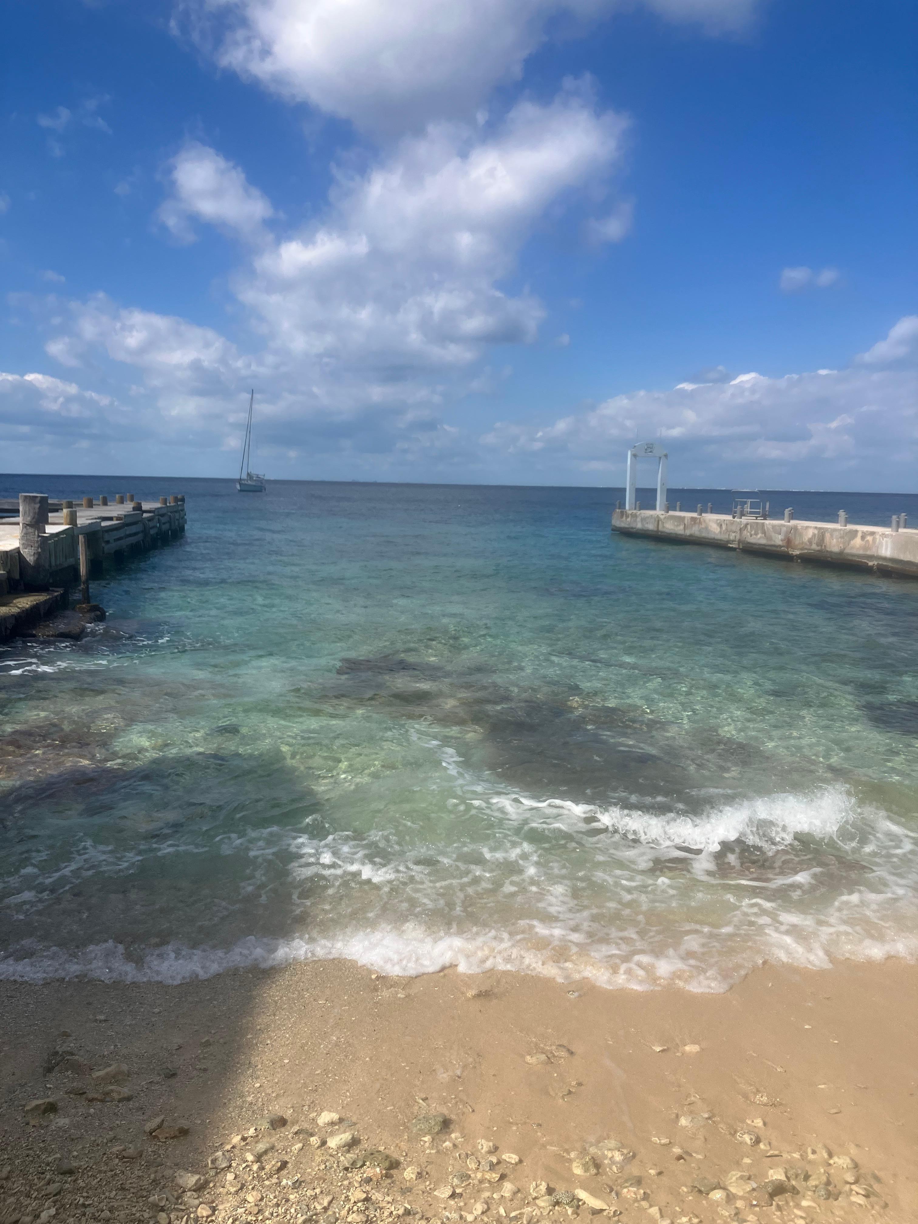 Beach across the screen.  Nice snorkeling with great visibility. 