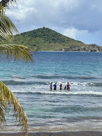 venturing into the ocean off the private beach