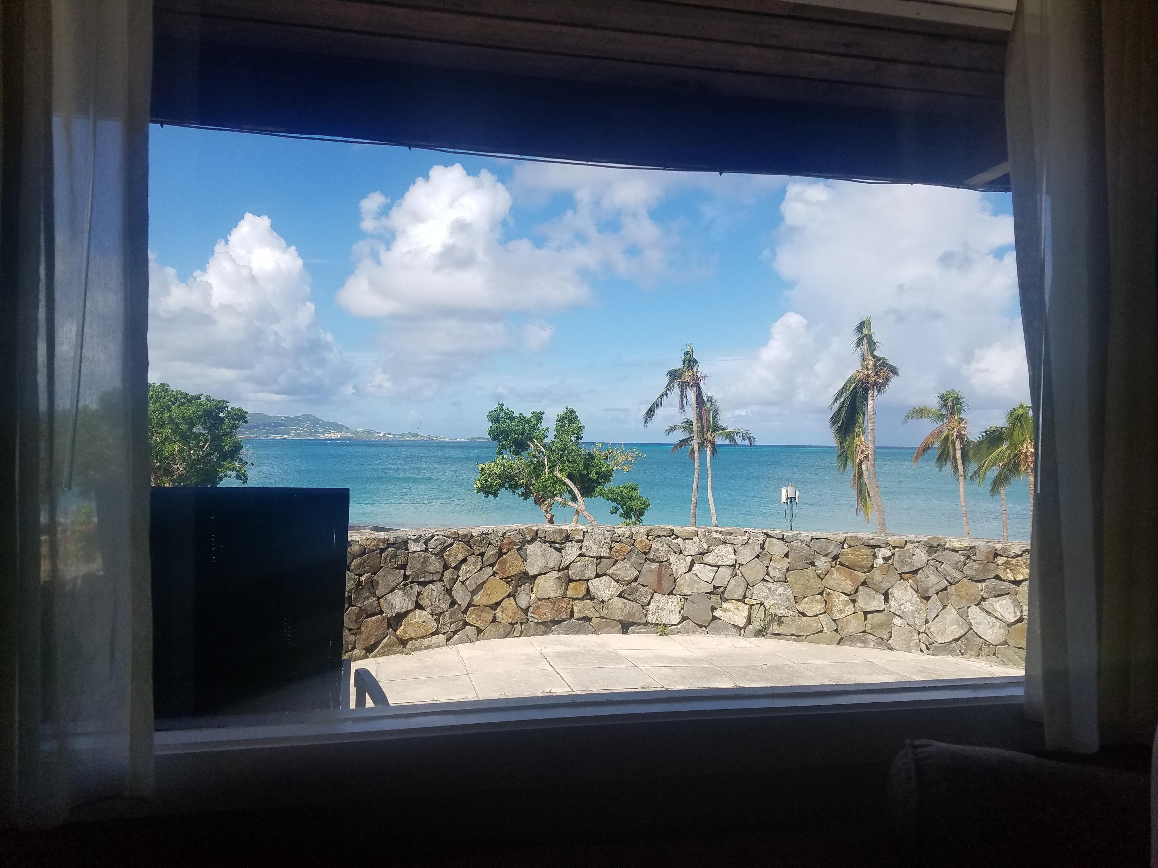 View from oceanfront room (Grotto beach where there is a new restaurant under construction down below the wall)