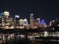 Nighttime view of Austin from the rooftop patio.