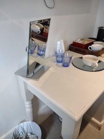 Broken vanity mirror which means it could not stand upright and was unusable. Room furniture in poor condition