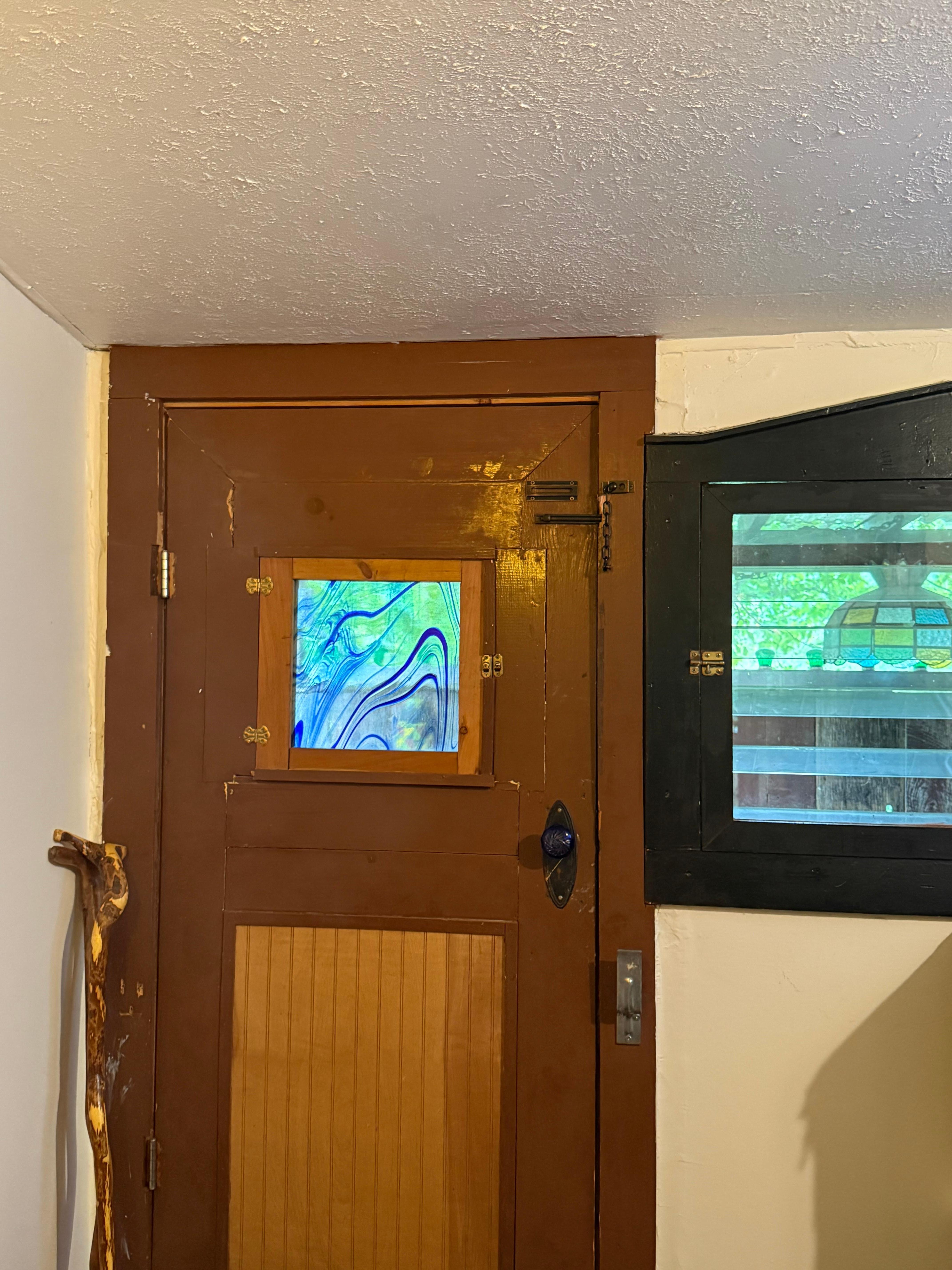 View of little door to deck, nice stained glass 