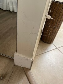 Damaged walls and baseboards.