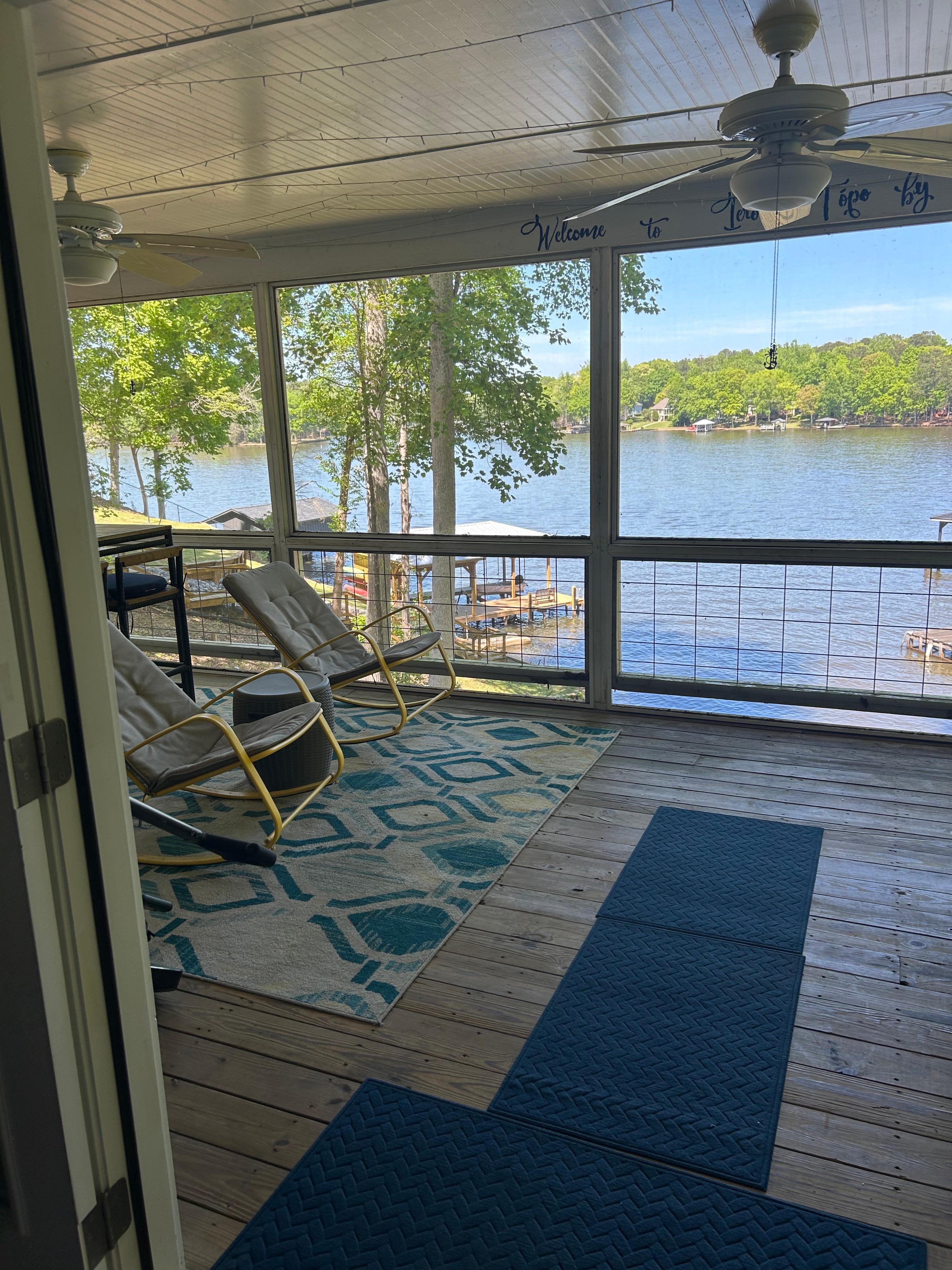 Gorgeous screen in  porch looking out over the water. May be the house’s best feature. 