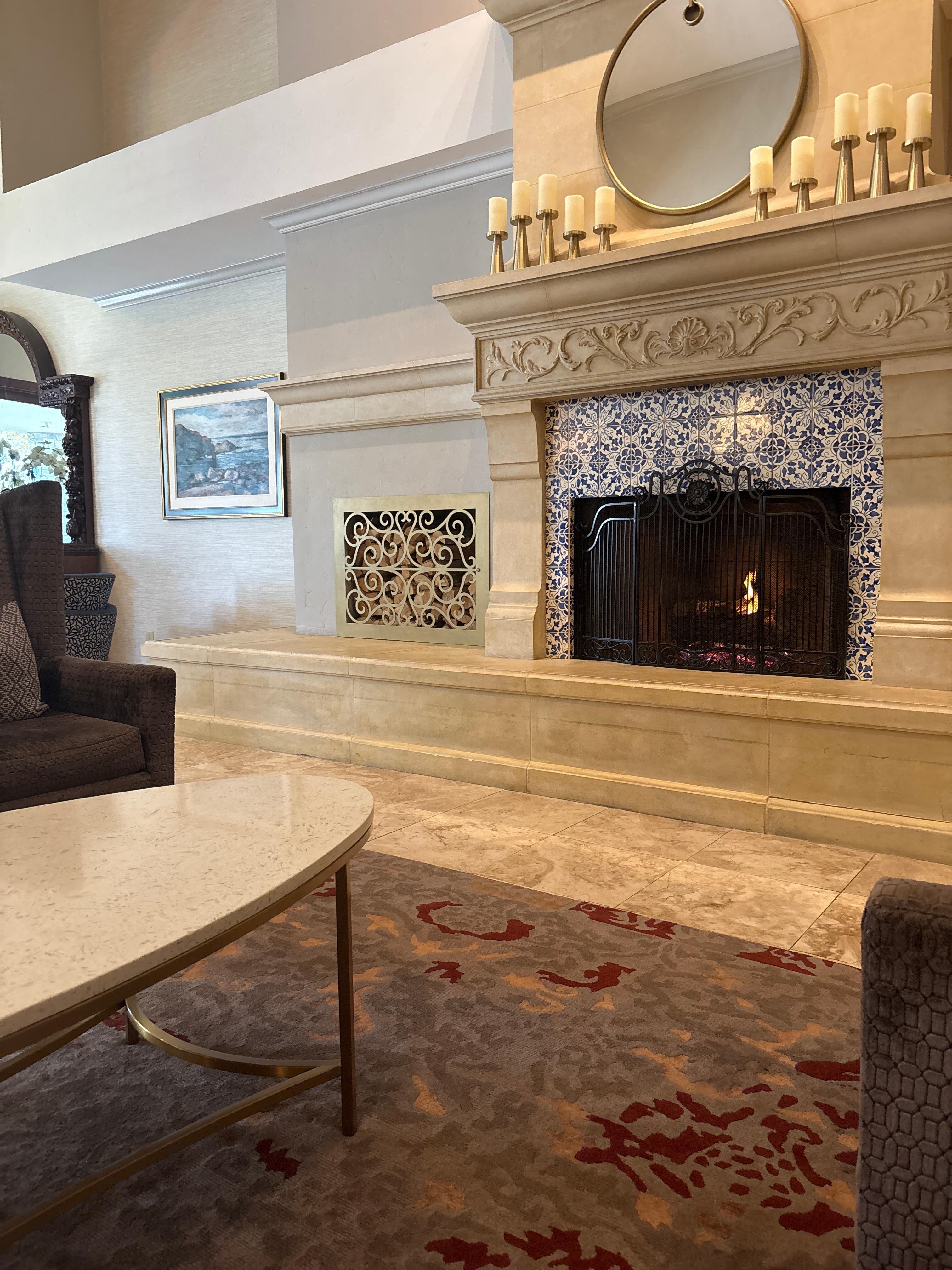 The sitting area in the second lounge in front of the fireplace.