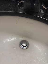 What's up with the dry glue that dripped everywhere when installing the sink?