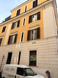 Building from street. Windows of second from top row are the property.