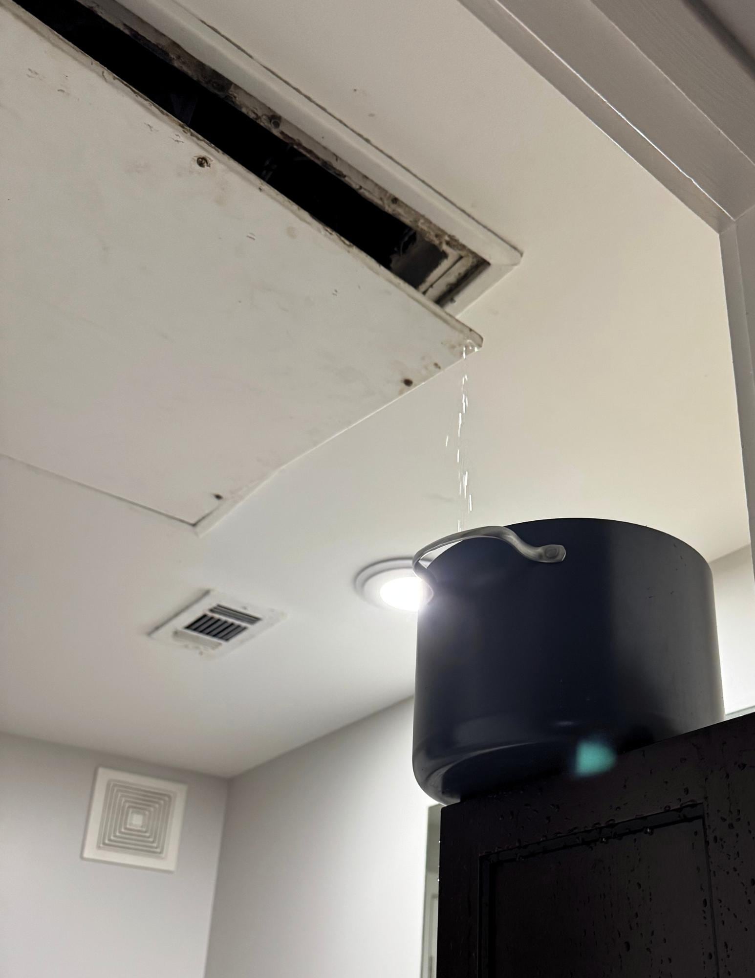 this gross ceiling panel filled with water then a huge gush of water poured out when it broke all over our toothbrushes and toiletries. It was so gross. 
